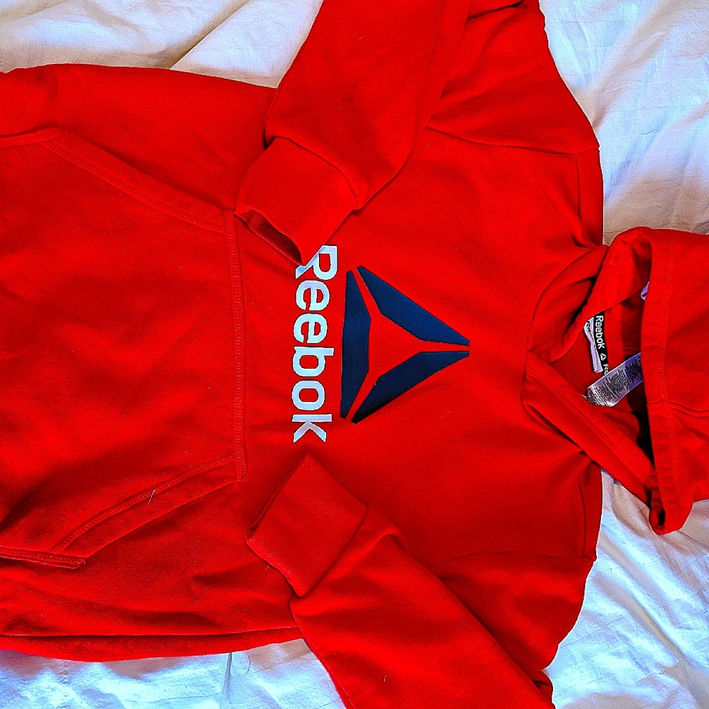 boys bright red gently used Reebok pullover jacke